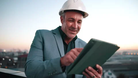 Hardhat, smile and tablet with architect on rooftop for city planning or project Stock Footage 337924051