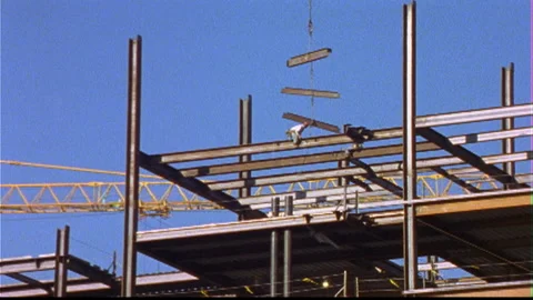 Hardhat workers attach short steel beams Stock Footage 144460929