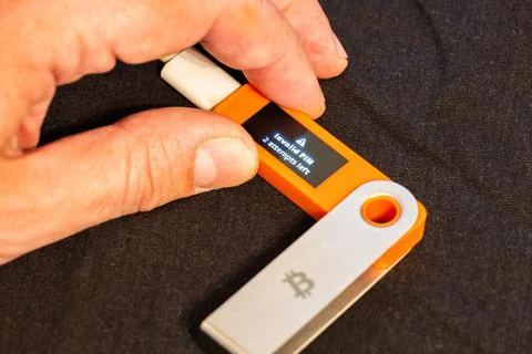 Hardware Bitcoin wallet with message Invalid PIN Stock Photos