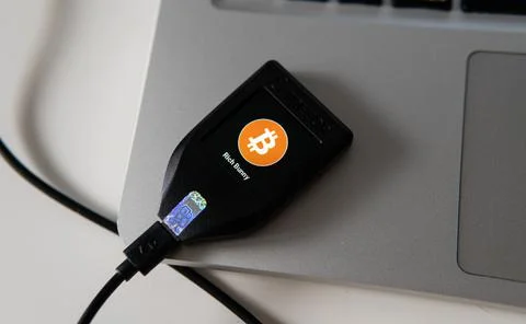 Hardware crypto wallet TREZOR MODEL T in male hands Stock Photos