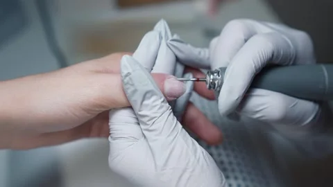 Hardware cuticle treatment during salon manicure Stock-Footage 343797690