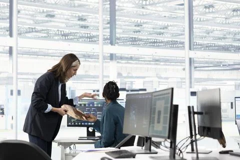 Hardware developer in microchip production fab office using machine learning Stock Photos