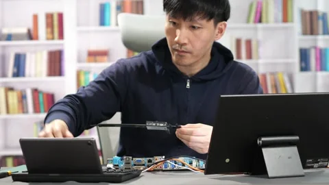 Hardware engineer programming new technology for artificial intelligence Stock Footage 295394961