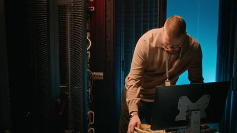 Hardware Engineer Setting Supercomputer in Server Room Stock Footage 311308635