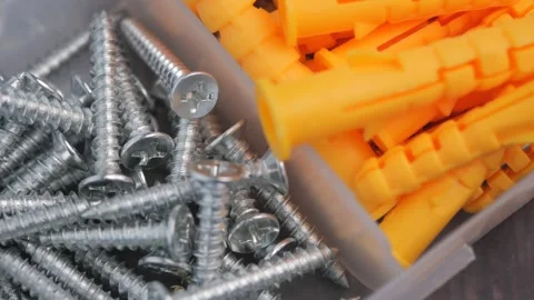 Hardware for home improvement self-tapping screws and plastic dowels in sma.. Stock Footage 332193419