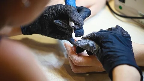 Hardware manicure. The final stage of removing the gel coating from the nail Stock Footage 153806476
