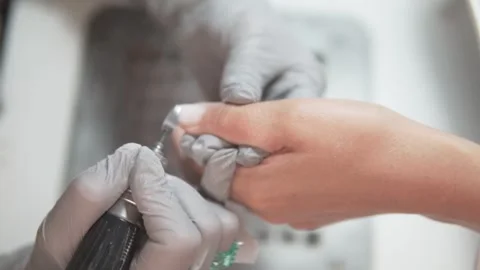 Hardware manicure of womens hands, close-up. Nail plate treatment Stock Footage 309624372
