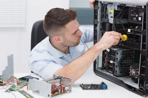 Hardware professional examining cpu with stethoscope Stock Photos