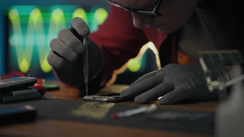Hardware. Service worker applies equipment carefully uses screwdriver in ele Stock Footage 283683045