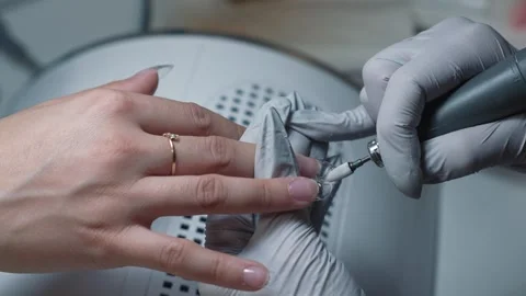 Hardware shortening of nail tip with drill during salon manicure Stock-Footage 343799551