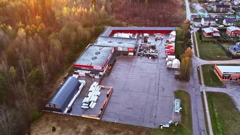 Hardware store Kurši and building material supply at sunset in aerial view Stock Footage 335893824