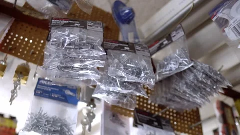 Hardware store products hanging on display wall Video stock 331272326