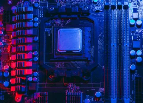 Hardware technology concept in neon light. Motherboard in blue-red light. Com Foto stock