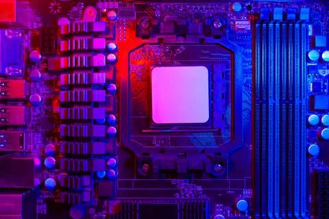 Hardware technology concept in neon light. Motherboard in blue-red light. Com Stock Photos