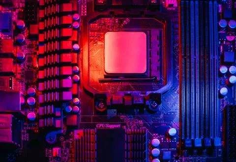 Hardware technology concept in neon light. Motherboard in blue-red light. Com Stock Photos