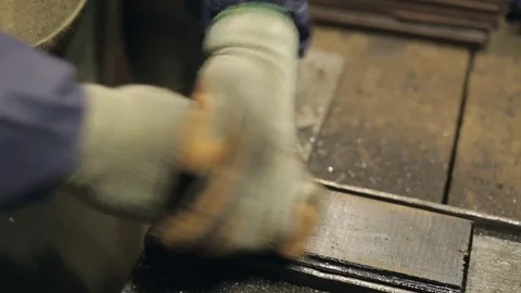 Hardwood Flooring Workshop - Scraping off the Old Tar Stock Footage 70304848