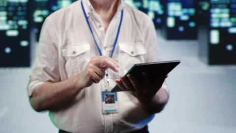 Hardworking admin optimizes data center Stock Footage 248646830