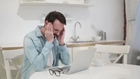 Hardworking Beard Young Man having Headache Stock Photos