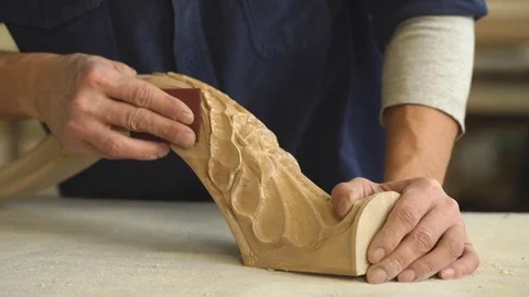 Hardworking carpenter polishing wood using abrasive paper Stock Footage 76277950