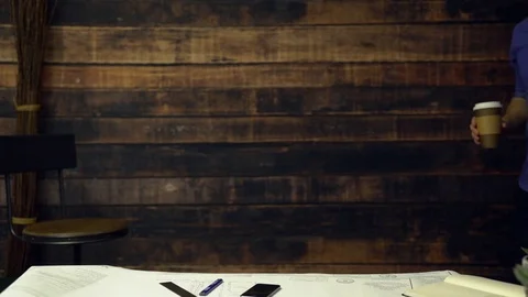 Hardworking engineer walks into office and works Stock Footage 85427297