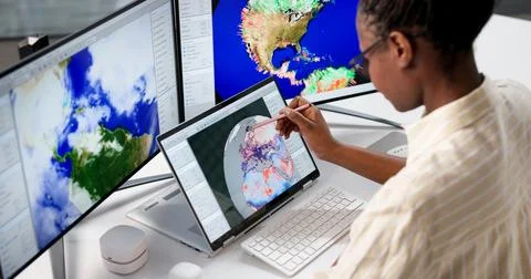 Hardworking Meteorologist Analyzing Climate Change Data On Desktop Computer Stock Photos
