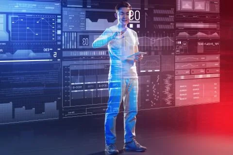 Hardworking web developer smiling while touching the big transparent screen Stock Photos