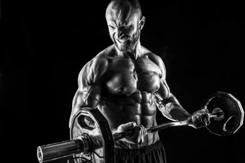 Hardy man doing exercise with heavy bar Stock Photos