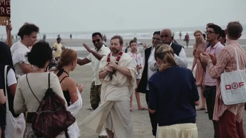 Hare Krishna devotees singing kirtan on a beach Stock Footage 345896618