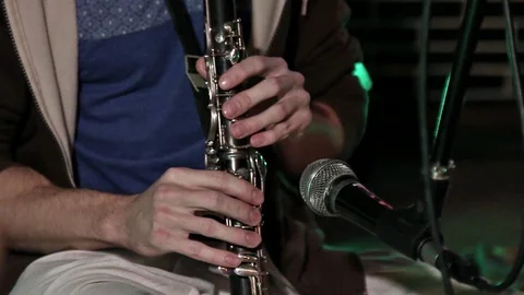 Hare Krishna Man Playing wind instrument clarinet Close-up. Video stock 103985263