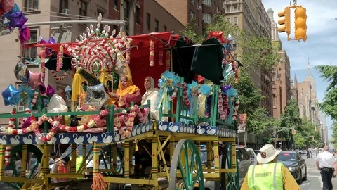 Hare Krishna parade on 5th Ave - float with Empire State Building background NYC Stock Footage 112078375