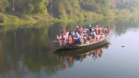 Hare Krishna pilgrims procession in a boat, Mayapur, India, 4k aerial Stock Footage 109287645