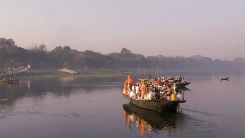 Hare Krishna pilgrims procession in a boat, India, 4k aerial Stock Footage 109321533
