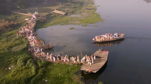 Hare Krishna pilgrims procession in a boat, India, 4k aerial Stock Footage 109321616