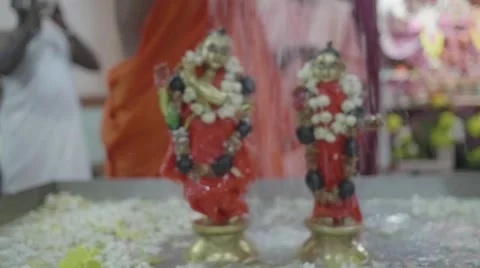 Hare Krishna statues being covered with water Stock Footage 60688089