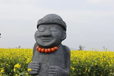 Hareubang black stone statue with yellow  in Jeju island Korea Stock Photos