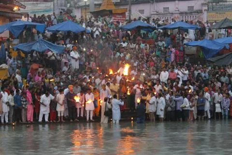 Haridwar, India - October 10 2014: Worshipers assembled early morning at dawn Stock Photos