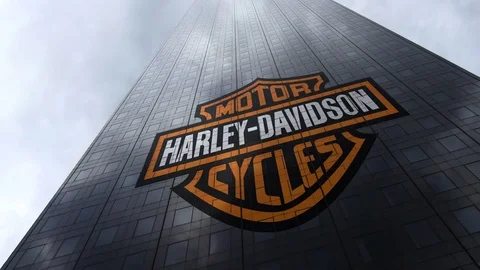 Harley-Davidson logo on a skyscraper facade reflecting clouds, time lapse Stock Footage 81111751