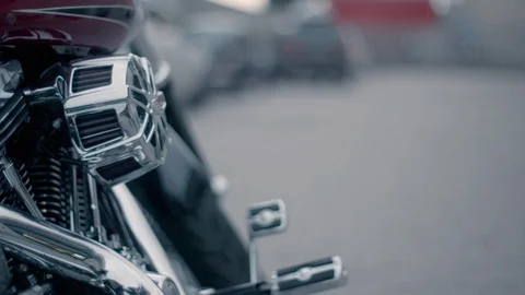 Harley Davidson motorcycle parked in parking area Stock Footage 89979079