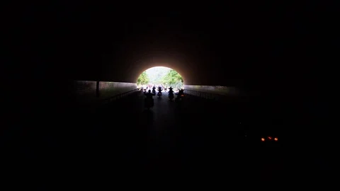 Harley Davidson riders pass through a tunnel during the annual rally Stock Footage 88728004