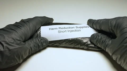 Harm reduction kit on the table, Program that includes services to lessen t.. 動画素材 334978339