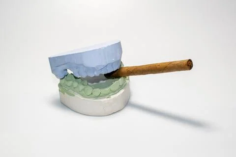 The harmful effects of smoking cigarettes, the harm of nicotine on teeth, tooth Stock Photos