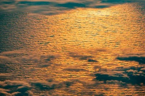 Harmonic background in golden sunset with scenic ocean wiew and bright oran.. Stock Photos