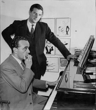 Harmonica Player Larry Adler At Piano With Author Kenneth Allsop 1959. Stock Photos