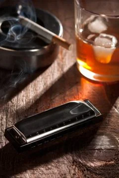 Harmonica with Whiskey and Cigarette Stock Photos