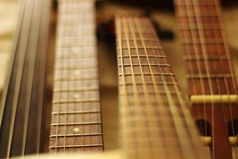 Harmonious Lines: A Composition of String Instrument Necks Stock Photos