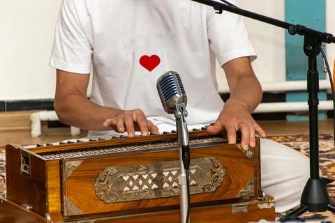 Harmonium player evoking themes of devotion, presence, and heartfelt expression Stock Photos