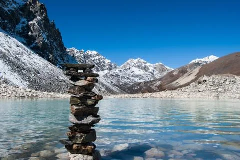 Harmony: stone stack and sacred gokyo lake Stock Photos