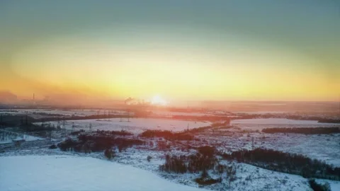 Harmony of Warm Sunset, Cold Land, and Industrial Might in Winter. Aerial Drone Stock Footage 257781364