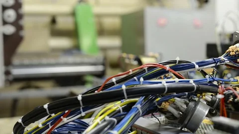 Harnesses of electrical cables lie on the circuit board. Stock Footage 83535880