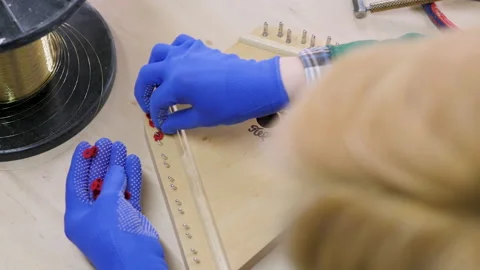 Harp. strings are installed in the musical harp. close-up. factory Vidéo 231855551